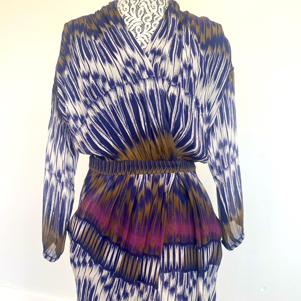 Wrap mini dress with buttoned waste; long sleeve with cinched wrist